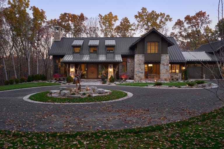 Beautiful Oak Grove construction project as night falls. Learn more about Colonial builders, a luxury home construction company